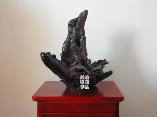 Natural animal type root carving - bird in nest